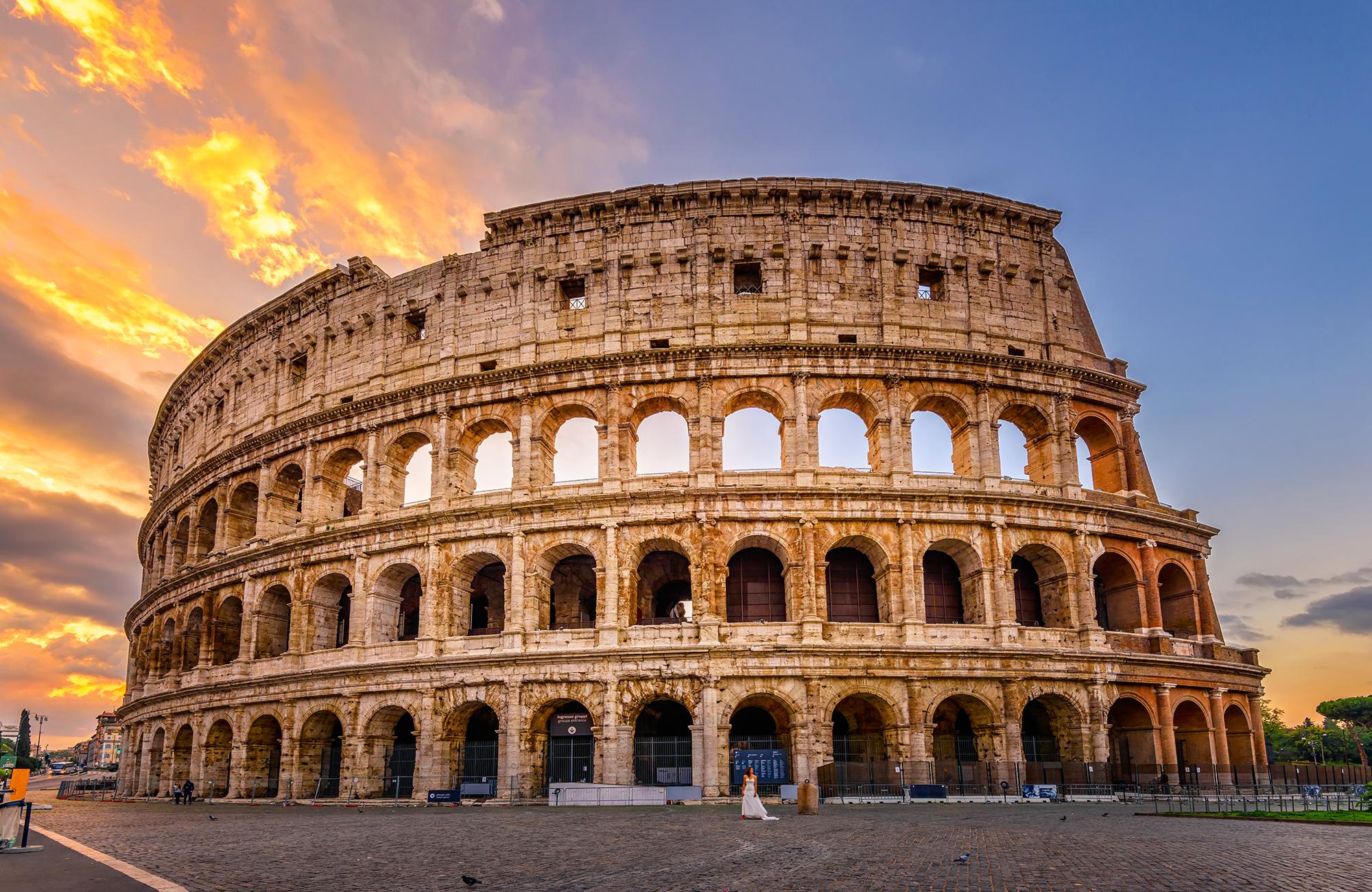 Photo of Rome Colosseum exterior with tourists